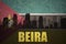 Abstract silhouette of the city with text Beira at the vintage mozambican flag