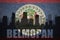 Abstract silhouette of the city with text Belmopan at the vintage belize flag