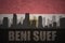 Abstract silhouette of the city with text Beni Suef at the vintage egyptian flag