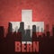 Abstract silhouette of the city with text Bern at the vintage swiss flag