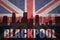 Abstract silhouette of the city with text Blackpool at the vintage british flag