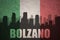 Abstract silhouette of the city with text Bolzano at the vintage italian flag