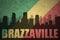 Abstract silhouette of the city with text Brazzaville at the vintage congolese flag