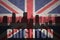 Abstract silhouette of the city with text Brighton at the vintage british flag