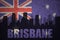 Abstract silhouette of the city with text Brisbane at the vintage australian flag