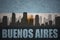 Abstract silhouette of the city with text Buenos Aires at the vintage argentinean flag