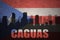 Abstract silhouette of the city with text Caguas at the vintage puerto rican flag