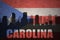 Abstract silhouette of the city with text Carolina at the vintage puerto rican flag