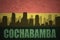 Abstract silhouette of the city with text Cochabamba at the vintage bolivian flag