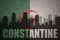 Abstract silhouette of the city with text Constantine at the vintage algerian flag