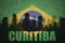 Abstract silhouette of the city with text Curitiba at the vintage brazilian flag