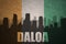 Abstract silhouette of the city with text Daloa at the vintage ivorian flag