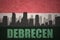 Abstract silhouette of the city with text Debrecen at the vintage hungarian flag