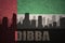 Abstract silhouette of the city with text Dibba at the vintage united arab emirates flag