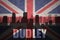 Abstract silhouette of the city with text Dudley at the vintage british flag