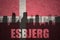 Abstract silhouette of the city with text Esbjerg at the vintage danish flag