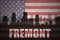 Abstract silhouette of the city with text Fremont at the vintage american flag