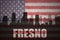 Abstract silhouette of the city with text Fresno at the vintage american flag