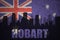 Abstract silhouette of the city with text Hobart at the vintage australian flag