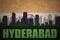 Abstract silhouette of the city with text Hyderabad at the vintage indian flag