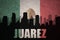 Abstract silhouette of the city with text Juarez at the vintage mexican flag