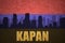 Abstract silhouette of the city with text Kapan at the vintage armenian flag