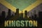 Abstract silhouette of the city with text Kingston at the vintage jamaican flag