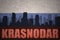 Abstract silhouette of the city with text Krasnodar at the vintage russian flag