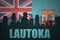 Abstract silhouette of the city with text Lautoka at the vintage Fiji flag