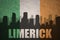 Abstract silhouette of the city with text Limerick at the vintage irish flag