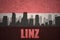 Abstract silhouette of the city with text Linz at the vintage austrian flag