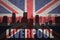 Abstract silhouette of the city with text Liverpool at the vintage british flag