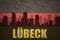 Abstract silhouette of the city with text Lubeck at the vintage german flag