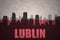 Abstract silhouette of the city with text Lublin at the vintage polish flag