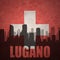 Abstract silhouette of the city with text Lugano at the vintage swiss flag