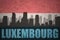 Abstract silhouette of the city with text luxembourg at the vintage luxembourg flag