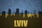 Abstract silhouette of the city with text Lviv at the vintage ukrainian flag