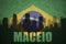 Abstract silhouette of the city with text Maceio at the vintage brazilian flag