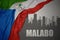 Abstract silhouette of the city with text Malabo near waving colorful national flag of equatorial guinea on a gray background