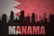 abstract silhouette of the city with text Manama at the vintage bahrain flag