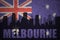 Abstract silhouette of the city with text Melbourne at the vintage australian flag