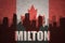 Abstract silhouette of the city with text Milton at the vintage canadian flag