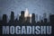 Abstract silhouette of the city with text Mogadishu at the vintage somalia flag