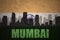 Abstract silhouette of the city with text Mumbai at the vintage indian flag