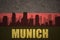 Abstract silhouette of the city with text Munich at the vintage german flag