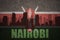 Abstract silhouette of the city with text Nairobi at the vintage kenyan flag