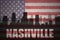 Abstract silhouette of the city with text Nashville at the vintage american flag
