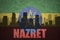 Abstract silhouette of the city with text Nazret at the vintage ethiopian flag