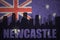 Abstract silhouette of the city with text Newcastle at the vintage australian flag
