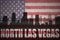 Abstract silhouette of the city with text North Las Vegas at the vintage american flag